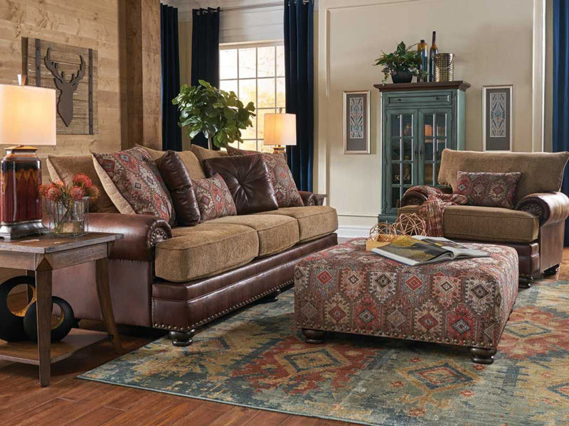 Image of light brown sofa, chair and ottoman with various decorations